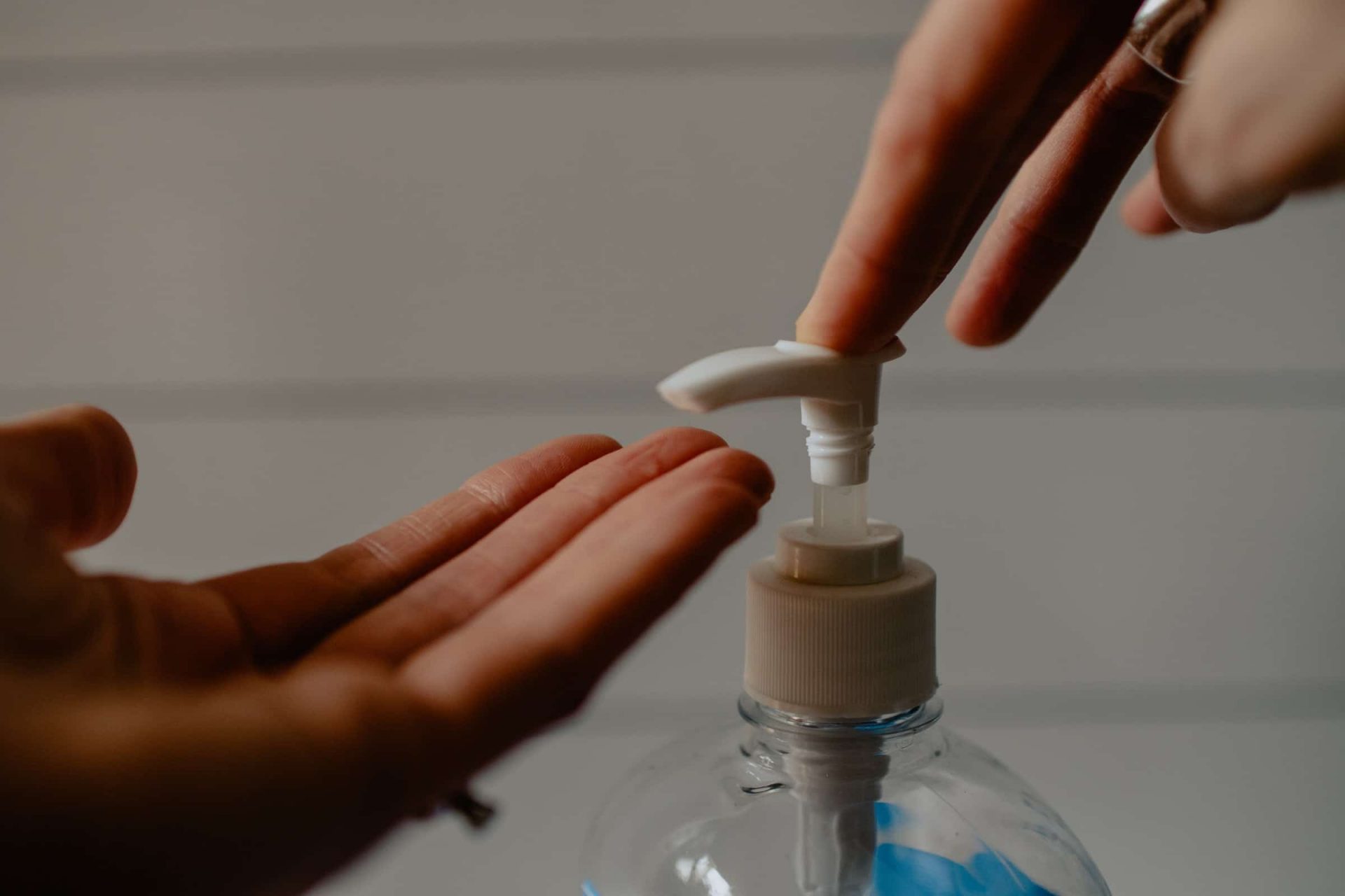 woman applying gel alcohol in her hands - Hygiene and Safety in Hospitality